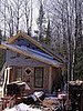 I love that little diamond-shaped window--also salvaged!